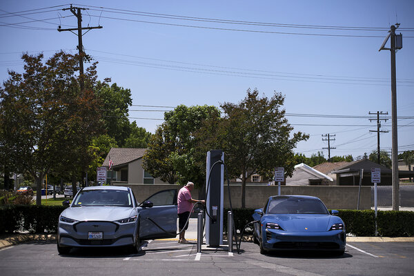 Electric vehicles charge at an Electrify America station in Arcadia, California, in May. The state's outsize role in setting vehicle emissions standards has become a target of the Trump administration and the U.S. Congress. 